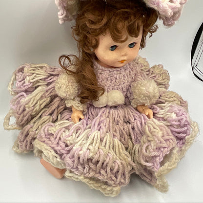 Vintage doll featuring a custom, handmade crochet dress and bonnet