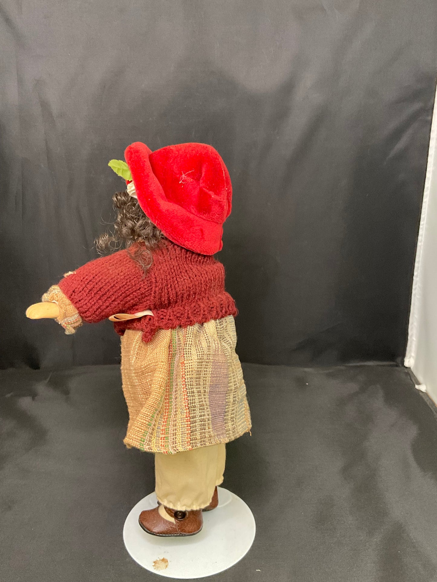 Vintage Porcelain Doll With a Red Beanie and Coat
