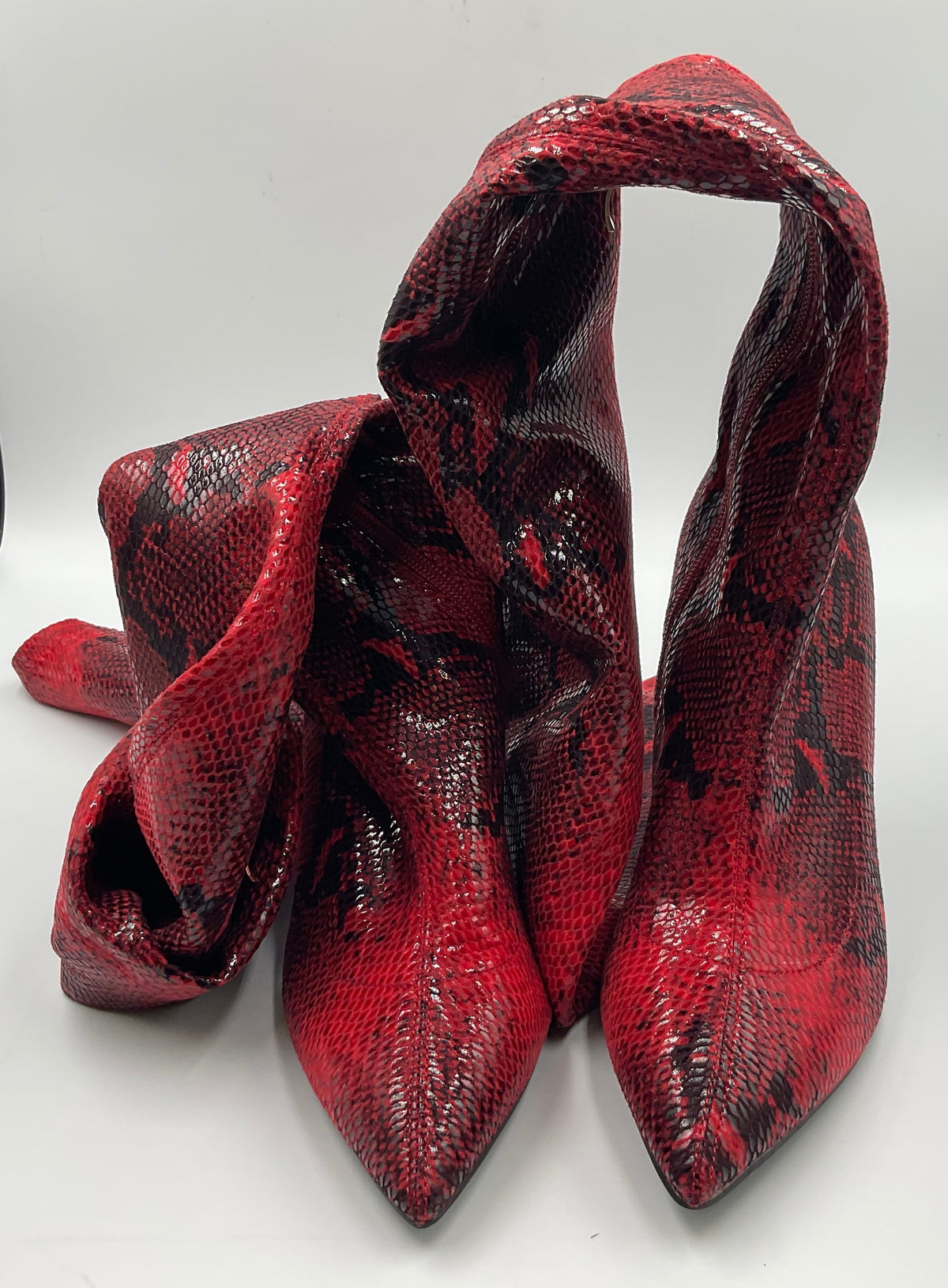 Mei Oi snakeskin-pattern over-the-knee boots