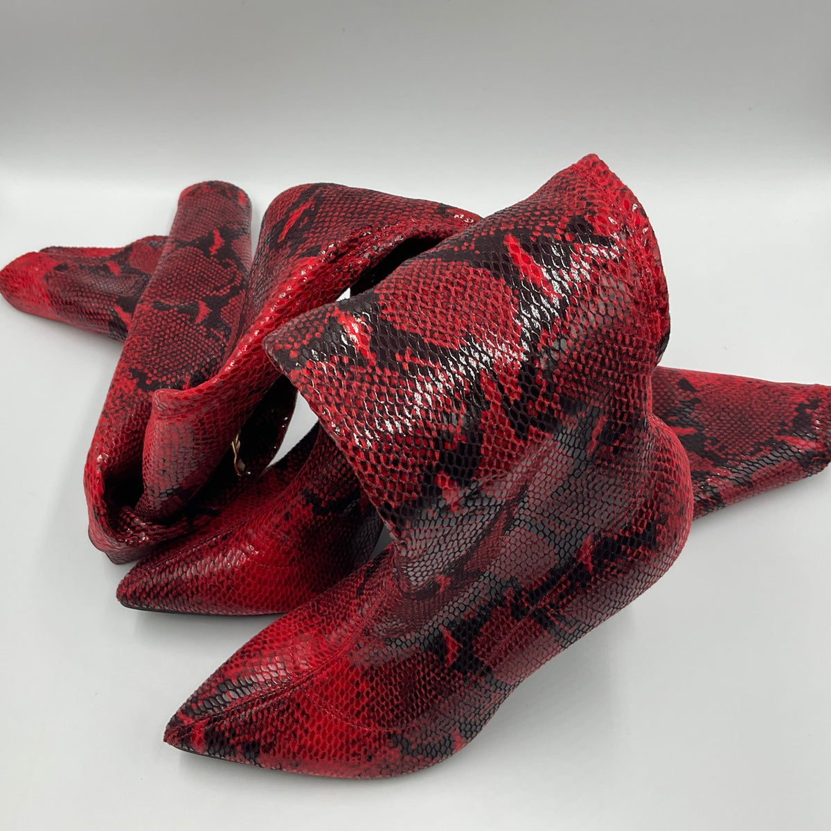 Mei Oi snakeskin-pattern over-the-knee boots