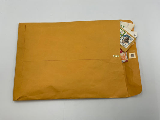 Orange Kraft Envelope With With Vintage Post Stamps
